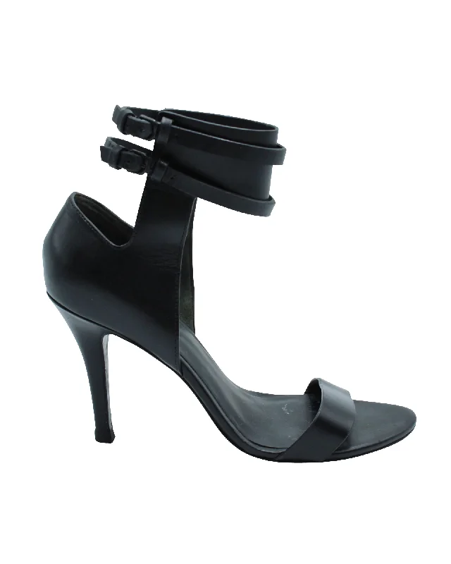 Women's patent leather stiletto heel pumps with a high - shine finishAlexander Wang Ankle Strap Heeled Sandals in Black Leather