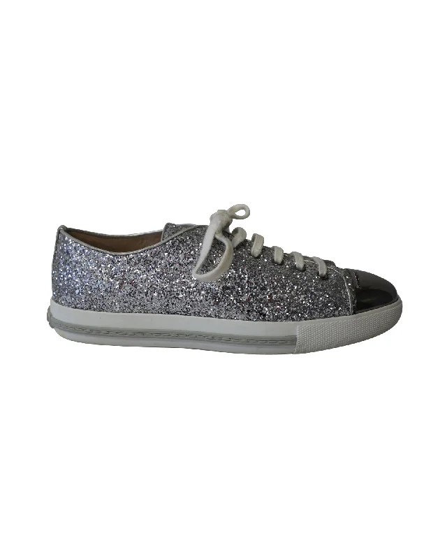 Foldable Women's Travel Sneakers for Compact Storage in LuggageMiu Miu Glitter Sneakers in Metallic Silver Leather